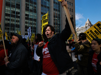 Demonstrators march in Washington, D.C. on March 18, 2023 during an anti-war protest organized by the Answer Coalition and dozens of other g...