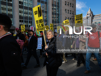 Demonstrators march in Washington, D.C. on March 18, 2023 during an anti-war protest organized by the Answer Coalition and dozens of other g...