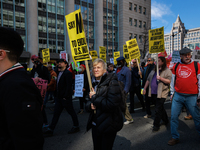 Demonstrators march in Washington, D.C. on March 18, 2023 during an anti-war protest organized by the Answer Coalition and dozens of other g...