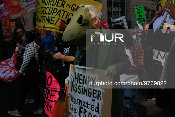 Demonstrators march in Washington, D.C. on March 18, 2023 during an anti-war protest organized by the Answer Coalition and dozens of other g...