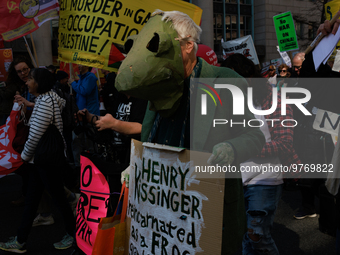 Demonstrators march in Washington, D.C. on March 18, 2023 during an anti-war protest organized by the Answer Coalition and dozens of other g...