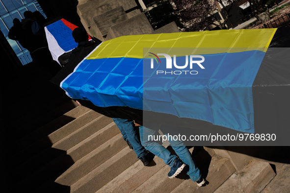 Demonstrators carry symbolic body caskets into The New York Avenue Presbyterian Church during an anti-war protest in Washington, D.C. on Mar...