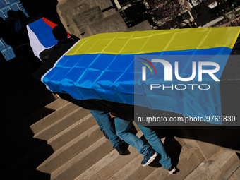 Demonstrators carry symbolic body caskets into The New York Avenue Presbyterian Church during an anti-war protest in Washington, D.C. on Mar...