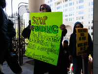 Demonstrators walk into The New York Avenue Presbyterian Church to listen to people speak during an anti-war protest in Washington, D.C. on...