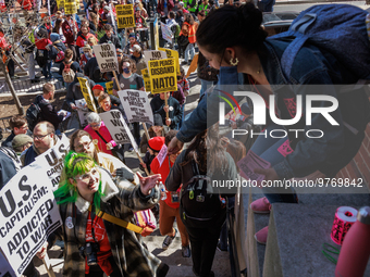 A woman hands out stickers as demonstrators walk into The New York Avenue Presbyterian Church to listen to people speak during an anti-war p...