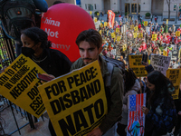 Demonstrators walk into The New York Avenue Presbyterian Church to listen to people speak during an anti-war protest in Washington, D.C. on...