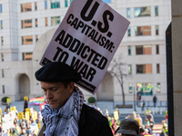 Demonstrators walk into The New York Avenue Presbyterian Church to listen to people speak during an anti-war protest in Washington, D.C. on...