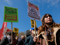 Demonstrators march in Washington, D.C. on March 18, 2023 during an anti-war protest organized by the Answer Coalition and dozens of other g...