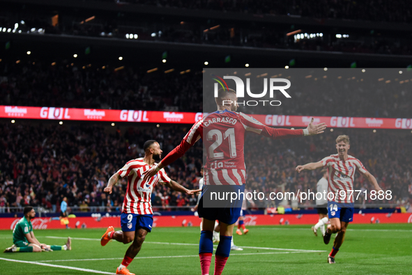 Yannick Carrasco, Memphis Depay and Marcos Llorente celebrates a goal during La Liga match between Atletico de Madrid and Valencia CF at Civ...