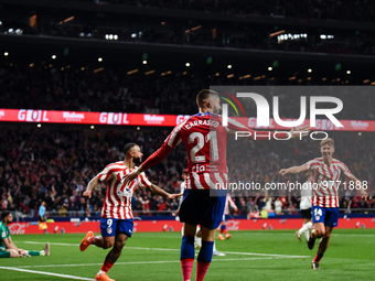 Yannick Carrasco, Memphis Depay and Marcos Llorente celebrates a goal during La Liga match between Atletico de Madrid and Valencia CF at Civ...