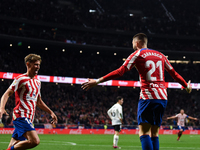 Yannick Carrasco and Marcos Llorente celebrates a goal during La Liga match between Atletico de Madrid and Valencia CF at Civitas Metropolit...