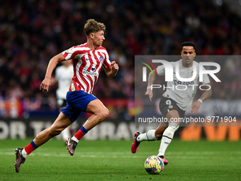 Marcos Llorente and Justin Kluivert during La Liga match between Atletico de Madrid and Valencia CF at Civitas Metropolitano on March 18, 20...