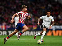 Marcos Llorente and Justin Kluivert during La Liga match between Atletico de Madrid and Valencia CF at Civitas Metropolitano on March 18, 20...