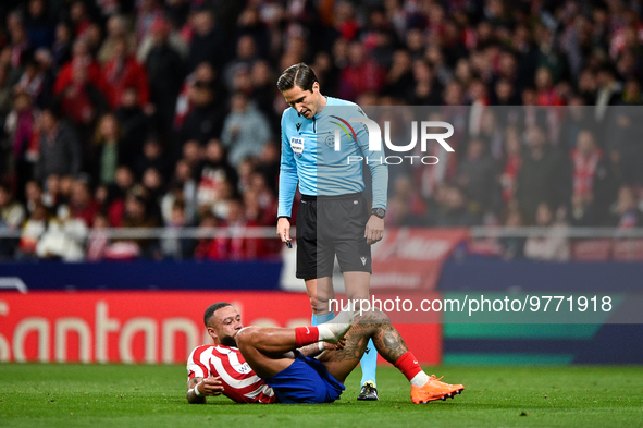 Munuera Montero and Memphis Depay during La Liga match between Atletico de Madrid and Valencia CF at Civitas Metropolitano on March 18, 2023...