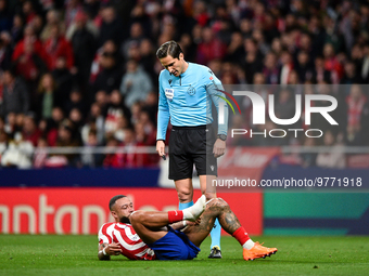 Munuera Montero and Memphis Depay during La Liga match between Atletico de Madrid and Valencia CF at Civitas Metropolitano on March 18, 2023...