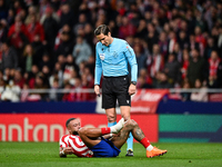 Munuera Montero and Memphis Depay during La Liga match between Atletico de Madrid and Valencia CF at Civitas Metropolitano on March 18, 2023...