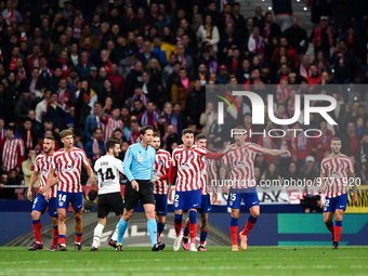 Munuera Montero, Josema Gimenez and Stefan Savic during La Liga match between Atletico de Madrid and Valencia CF at Civitas Metropolitano on...