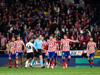 Munuera Montero, Josema Gimenez and Stefan Savic during La Liga match between Atletico de Madrid and Valencia CF at Civitas Metropolitano on...