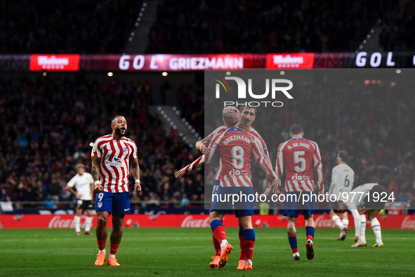 Antoine Griezmann, Memphis Depay and Stefan Savic celebrates a goal during La Liga match between Atletico de Madrid and Valencia CF at Civit...