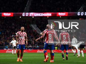 Antoine Griezmann, Memphis Depay and Stefan Savic celebrates a goal during La Liga match between Atletico de Madrid and Valencia CF at Civit...