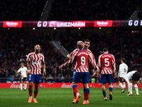 Antoine Griezmann, Memphis Depay and Stefan Savic celebrates a goal during La Liga match between Atletico de Madrid and Valencia CF at Civit...