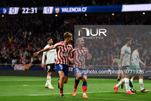 Marcos Llorente and Antoine Griezmann celebrates a goal during La Liga match between Atletico de Madrid and Valencia CF at Civitas Metropoli...