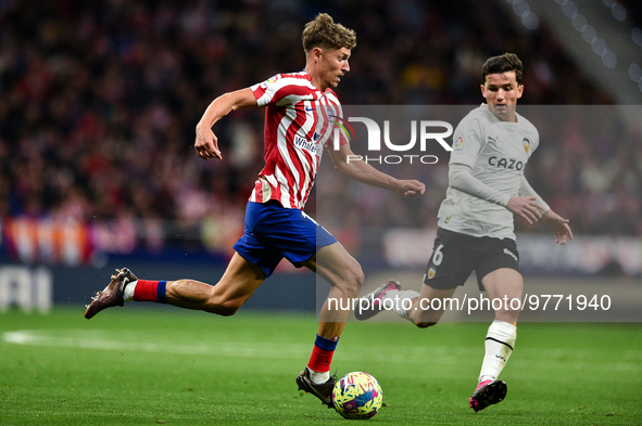 Marcos Llorente and Hugo Guillamon during La Liga match between Atletico de Madrid and Valencia CF at Civitas Metropolitano on March 18, 202...