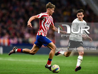 Marcos Llorente and Hugo Guillamon during La Liga match between Atletico de Madrid and Valencia CF at Civitas Metropolitano on March 18, 202...