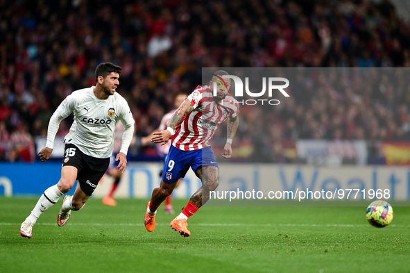 Memphis Depay and Cenk Ozkacar during La Liga match between Atletico de Madrid and Valencia CF at Civitas Metropolitano on March 18, 2023 in...