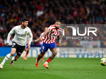 Memphis Depay and Cenk Ozkacar during La Liga match between Atletico de Madrid and Valencia CF at Civitas Metropolitano on March 18, 2023 in...