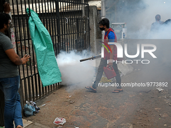 An employee of Dhaka south City Corporation sprays pesticide for kill mosquitoes in Dhaka, Bangladesh on March 19, 2023 (