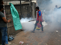 An employee of Dhaka south City Corporation sprays pesticide for kill mosquitoes in Dhaka, Bangladesh on March 19, 2023 (