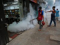 An employee of Dhaka south City Corporation sprays pesticide for kill mosquitoes in Dhaka, Bangladesh on March 19, 2023 (