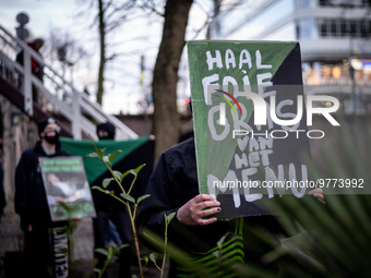 Activists at the entrance of a restaurant that serves foie gras, in Utrecht, Netherlands, on March 18, 2023.  (