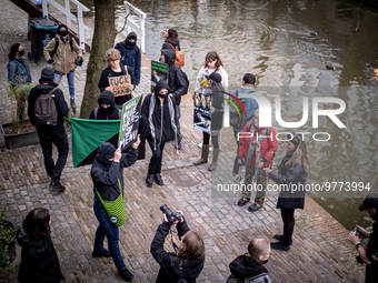 Activists at the entrance of a restaurant that serves foie gras, in Utrecht, Netherlands, on March 18, 2023.  (