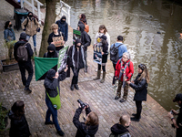 Activists at the entrance of a restaurant that serves foie gras, in Utrecht, Netherlands, on March 18, 2023.  (