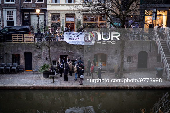 Activists at the entrance of a restaurant that serves foie gras, in Utrecht, Netherlands, on March 18, 2023.  