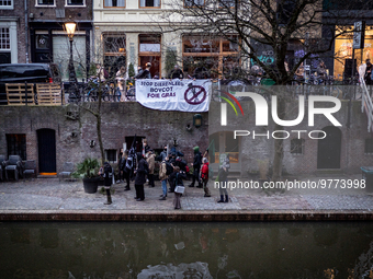 Activists at the entrance of a restaurant that serves foie gras, in Utrecht, Netherlands, on March 18, 2023.  (