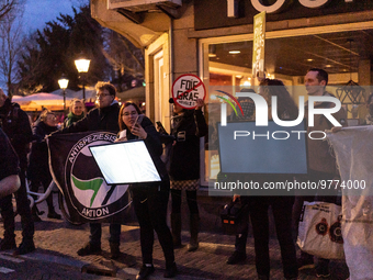 Activists at the entrance of a restaurant that serves foie gras, in Utrecht, Netherlands, on March 18, 2023.  (