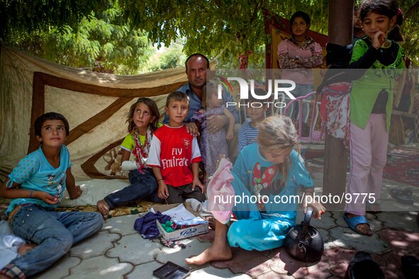 A young family in their open living space at Qushtepa Park Camp who contents over 1000 people in the park and more than 6000 in the neighbor...