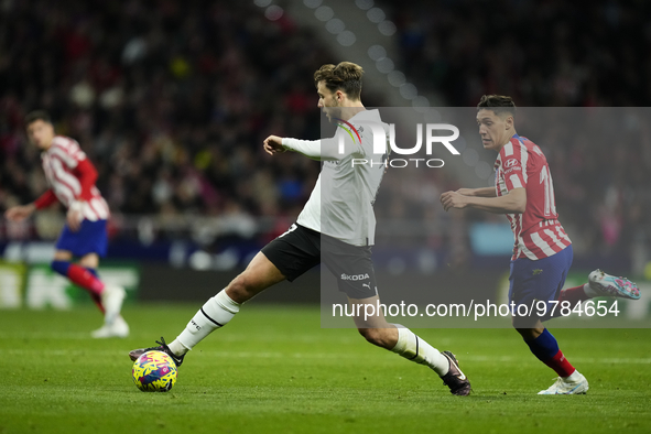 Nico Gonzalez central midfield of Valencia and Spain controls the ball during the La Liga Santander match between Atletico de Madrid and Val...