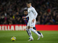 Federico Valverde central midfield of Real Madrid and Uruguay and Alejandro Balde left-back of Barcelona and Spain compete for the ball duri...
