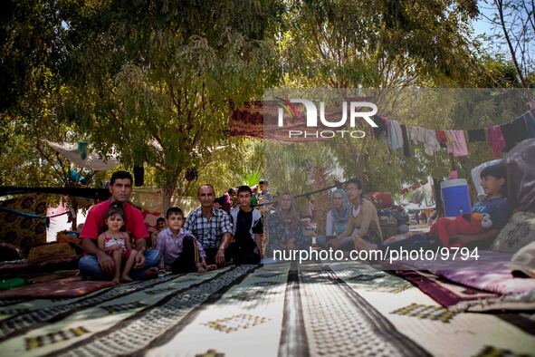 A big family fled from Syria about 7 days ago and went here in the Qushtepa Park near Erbil, where the have no tents and real shelter from t...