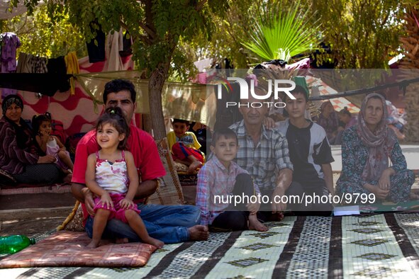 A refugee family in there livingroom who is outside without any refuge from the weather.

Photo: Flo Smith/NurPhoto