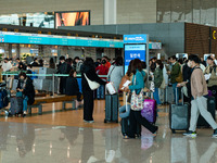 Passengers with luggages walk and wait check-in with Korean Air at Incheon International Airport on March 30, 2023, South Korea.
According t...