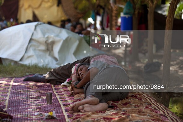 An old man in his bed room where he needs to sleep, cook and life with his entire family.

Photo: Flo Smith/NurPhoto