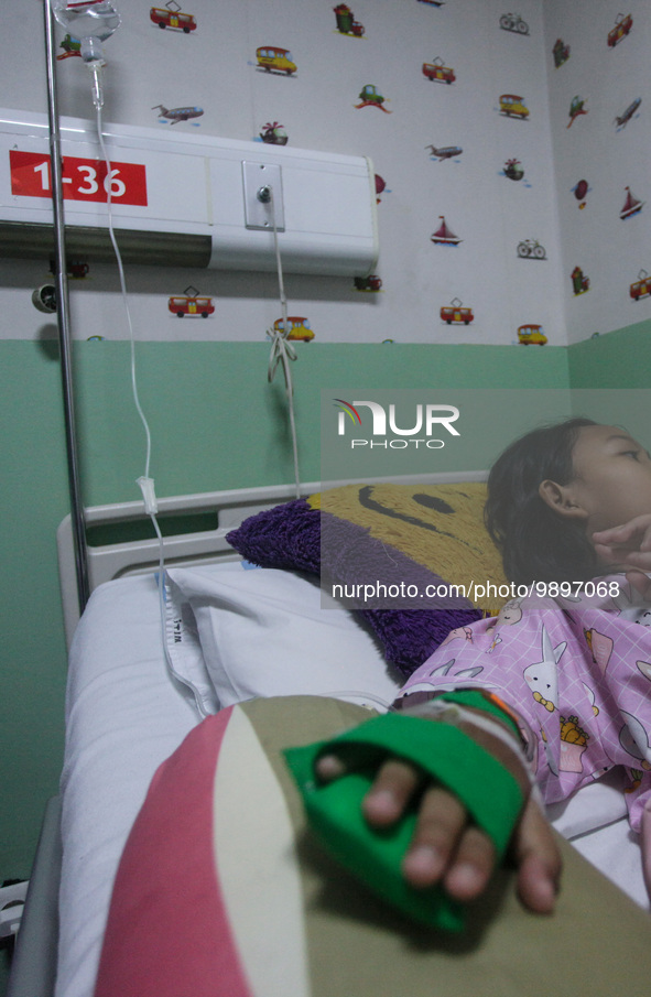 A young girl receive treatment from fever dengue at a hospital in Bogor, West Java, Indonesia on April 11, 2023. The World Health Organizati...