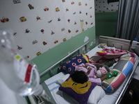 A young girl receive treatment from fever dengue at a hospital in Bogor, West Java, Indonesia on April 11, 2023. The World Health Organizati...