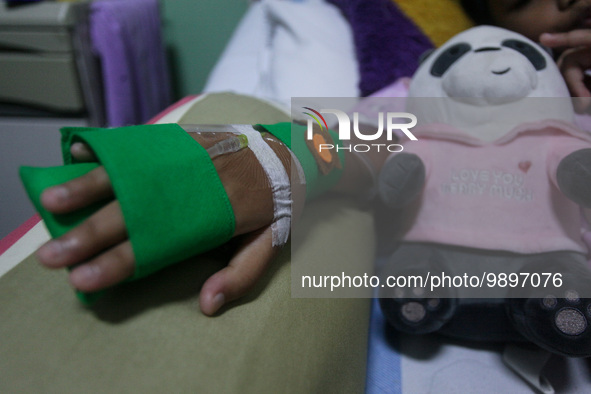 A young girl receive treatment from fever dengue at a hospital in Bogor, West Java, Indonesia on April 11, 2023. The World Health Organizati...