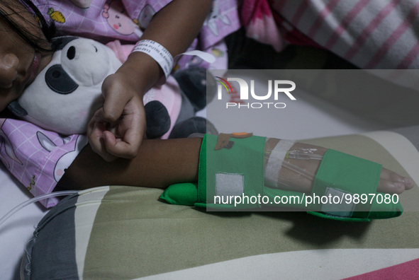 A young girl receive treatment from fever dengue at a hospital in Bogor, West Java, Indonesia on April 11, 2023. The World Health Organizati...